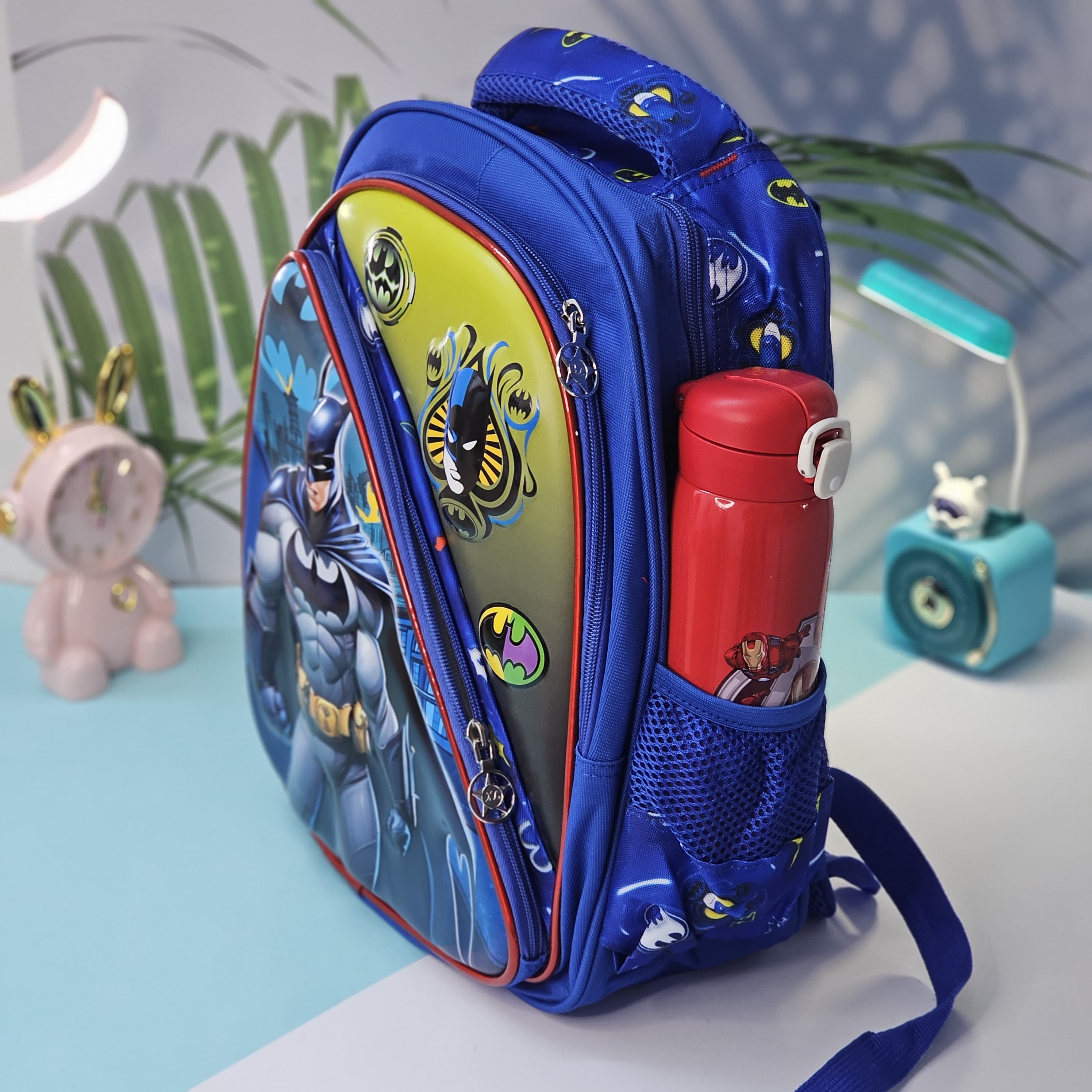 "Stylish and practical Usmile Toys backpack for boys, adorned with popular cartoon superhero characters, including Iron Man and Thor." www.usmile.toys
